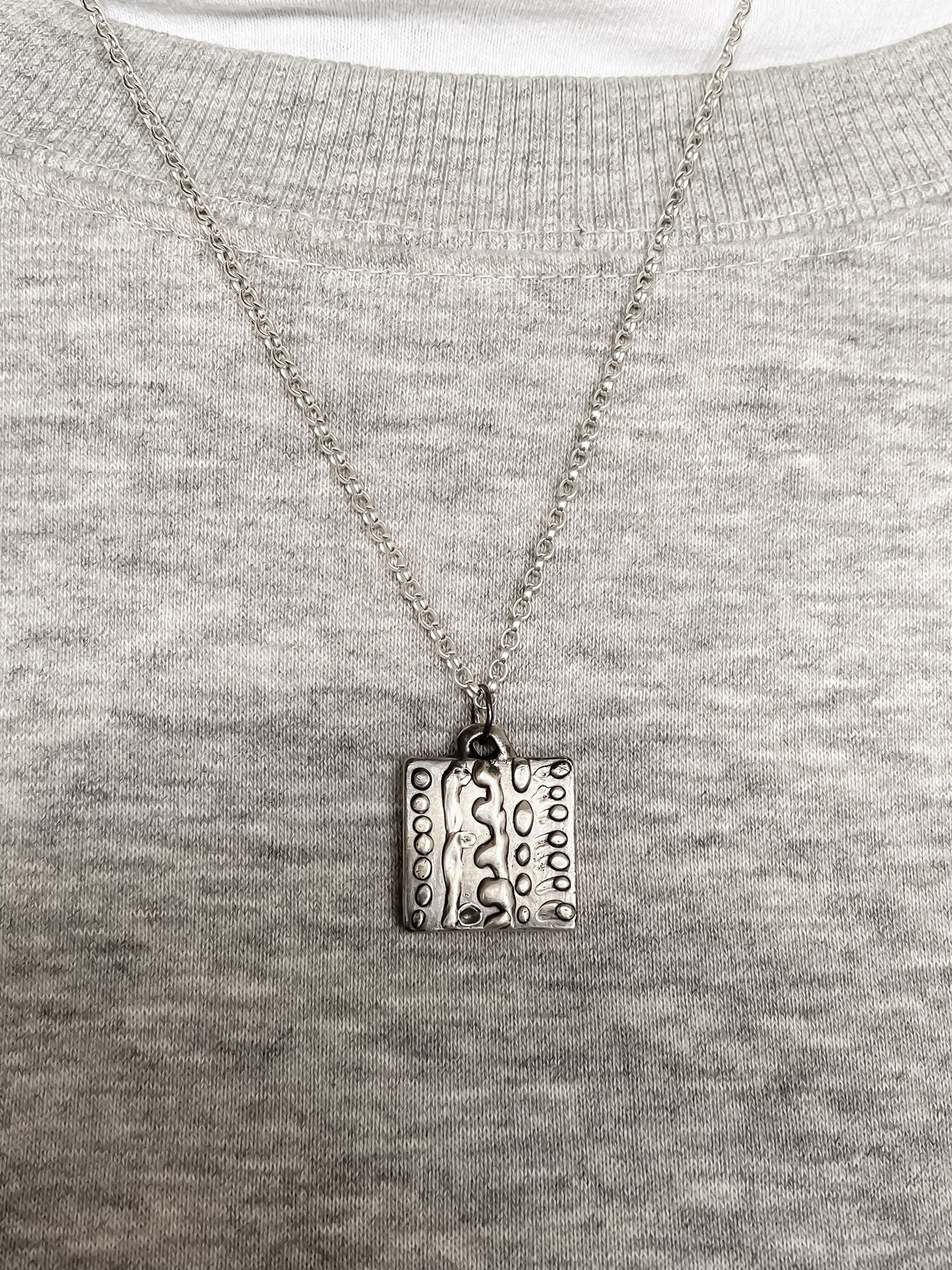 Dotty Pendant worn on grey knit for soft contrast - textured, square happy buddha, oxidised organic texture gold or silver free shipping
