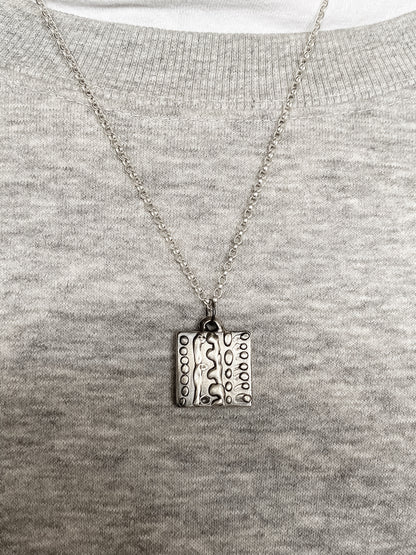 Dotty Pendant worn on grey knit for soft contrast - textured, square happy buddha, oxidised organic texture gold or silver free shipping