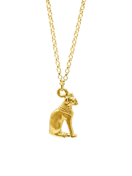 Minimalist gold Bast Cat Pendant close-up on grey background, ancient Egyptian goddess symbol. MOCA Jewellery ahandmade.