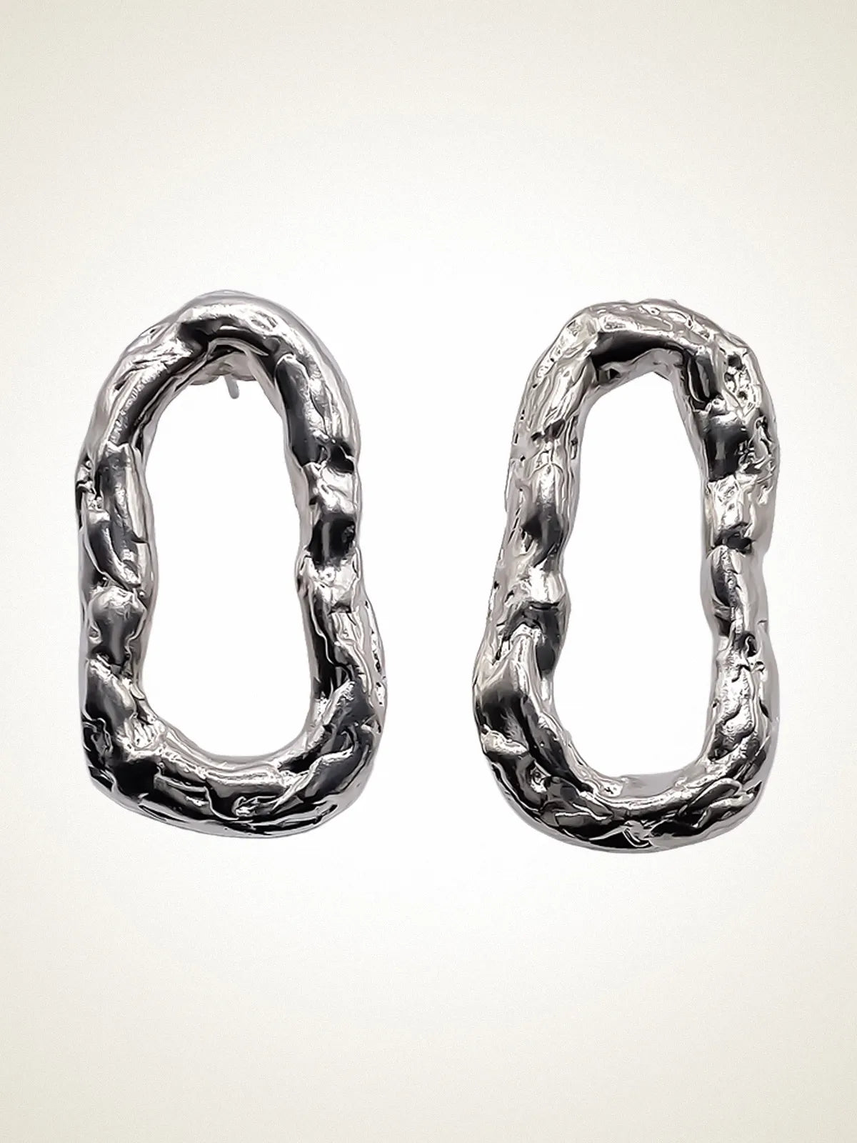 Flow Loop Earrings artisan crafted ring in premium metal, timeless style, lifestyle shot