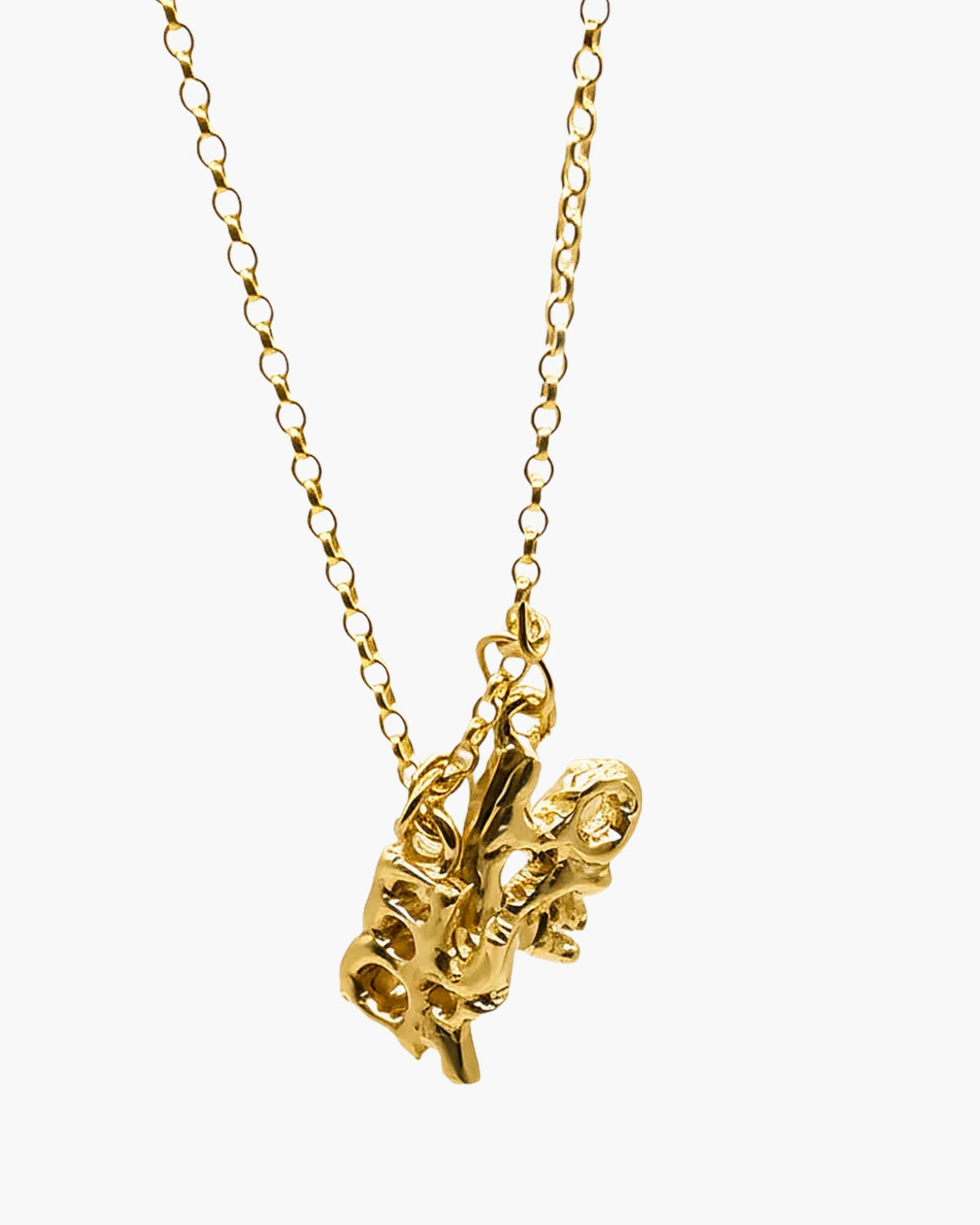 Gold vermeil Fuck + Love pendant at an angle