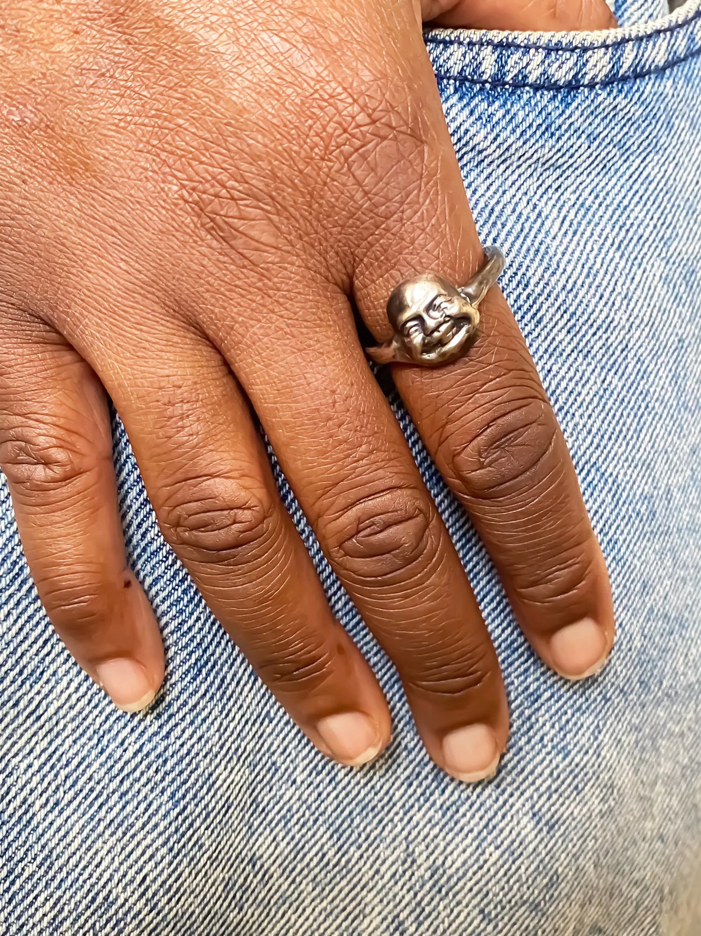 Buddha Finger Ring designer ring in premium metal, serene face, side view
