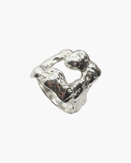 Sterling silver Mask Ring at an angle