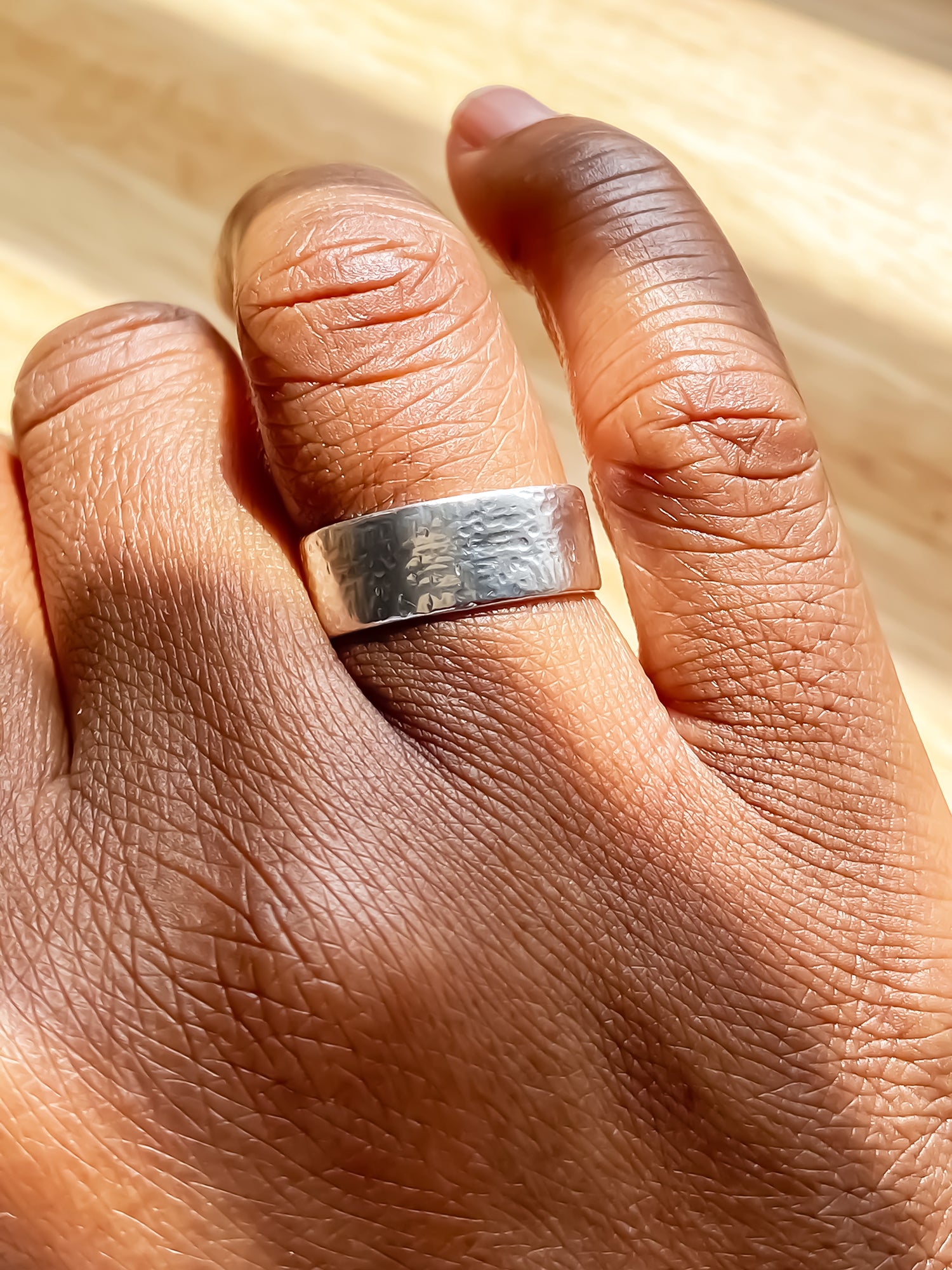 May's Ring with hammered texture in minimal gold or silver, understated design, offering free shipping