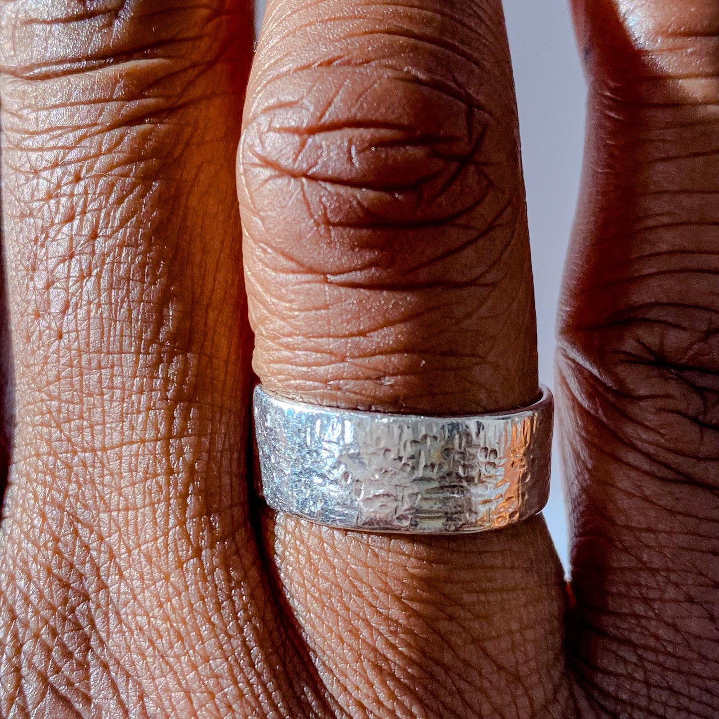May's Ring in silver or gold with a hammered texture for an understated, minimal look, featuring free shipping