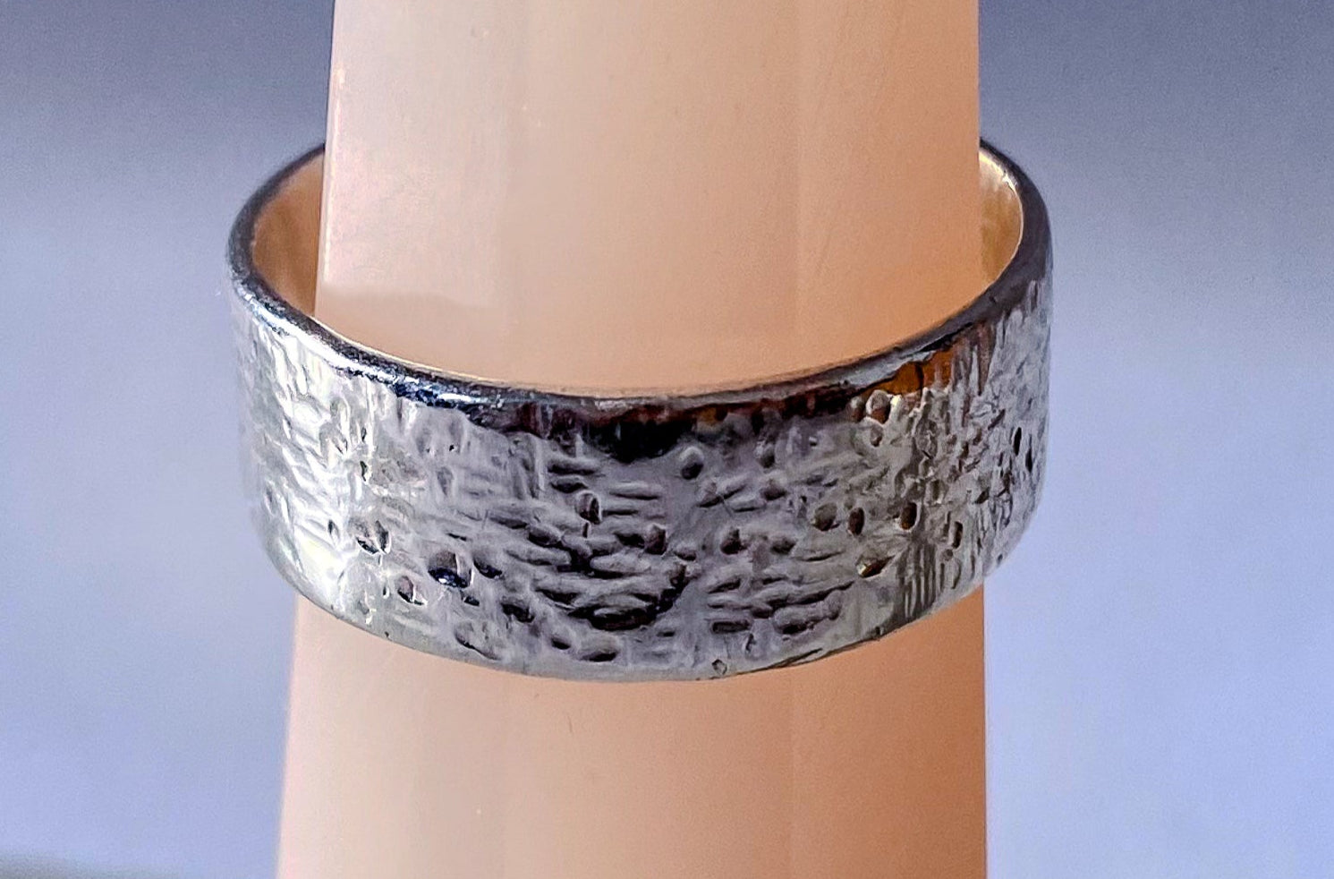 May's Ring with hammered texture in silver or gold, showcasing an understated, minimal design with free shipping