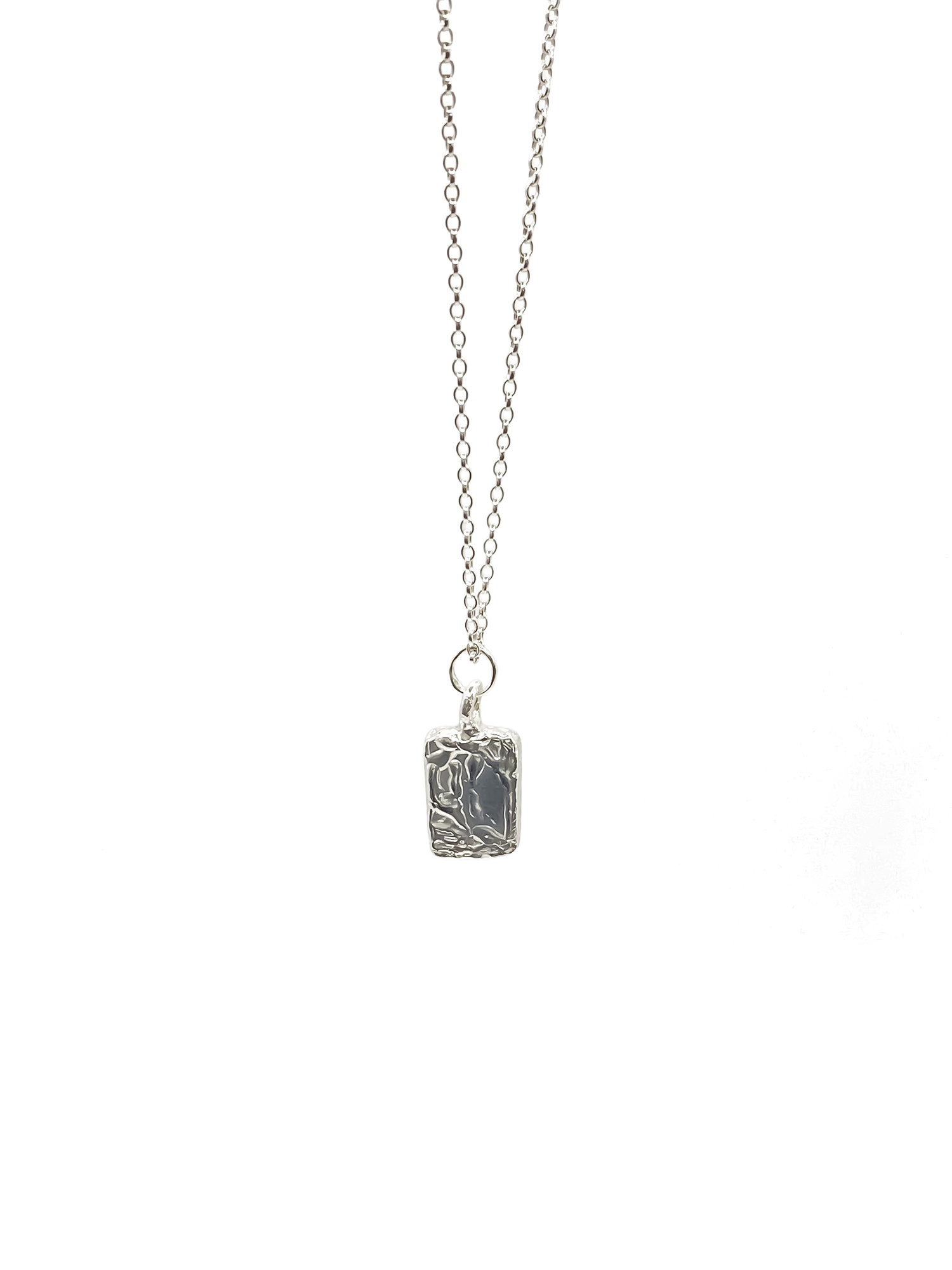 Minimal rectangular sculpted pendant hanging from chain, sleek textured silver or gold with delicate details and free shipping
