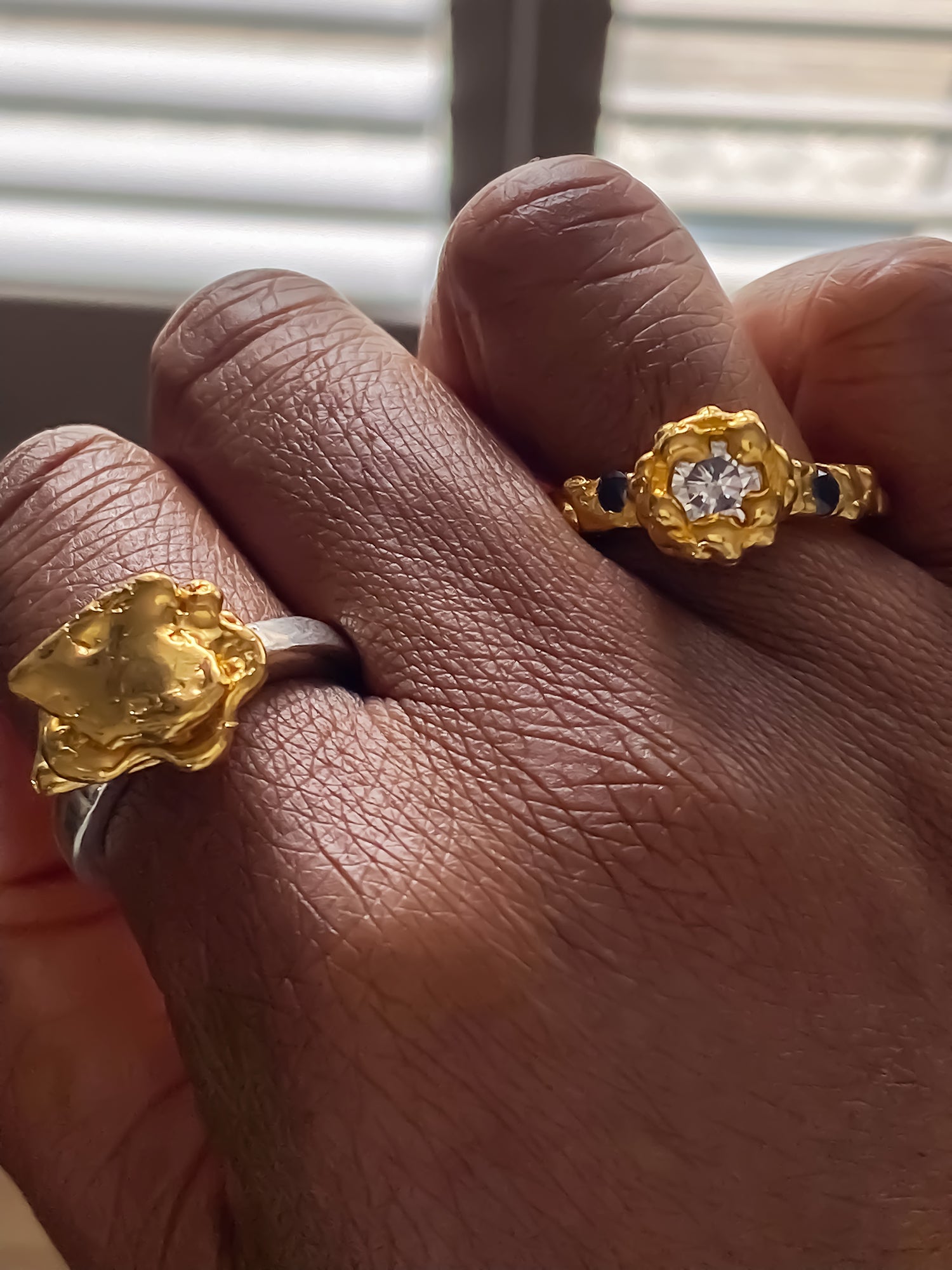 Textured gold ring set with sculptural form and gemstone accents, MOCA Jewellery exclusive.