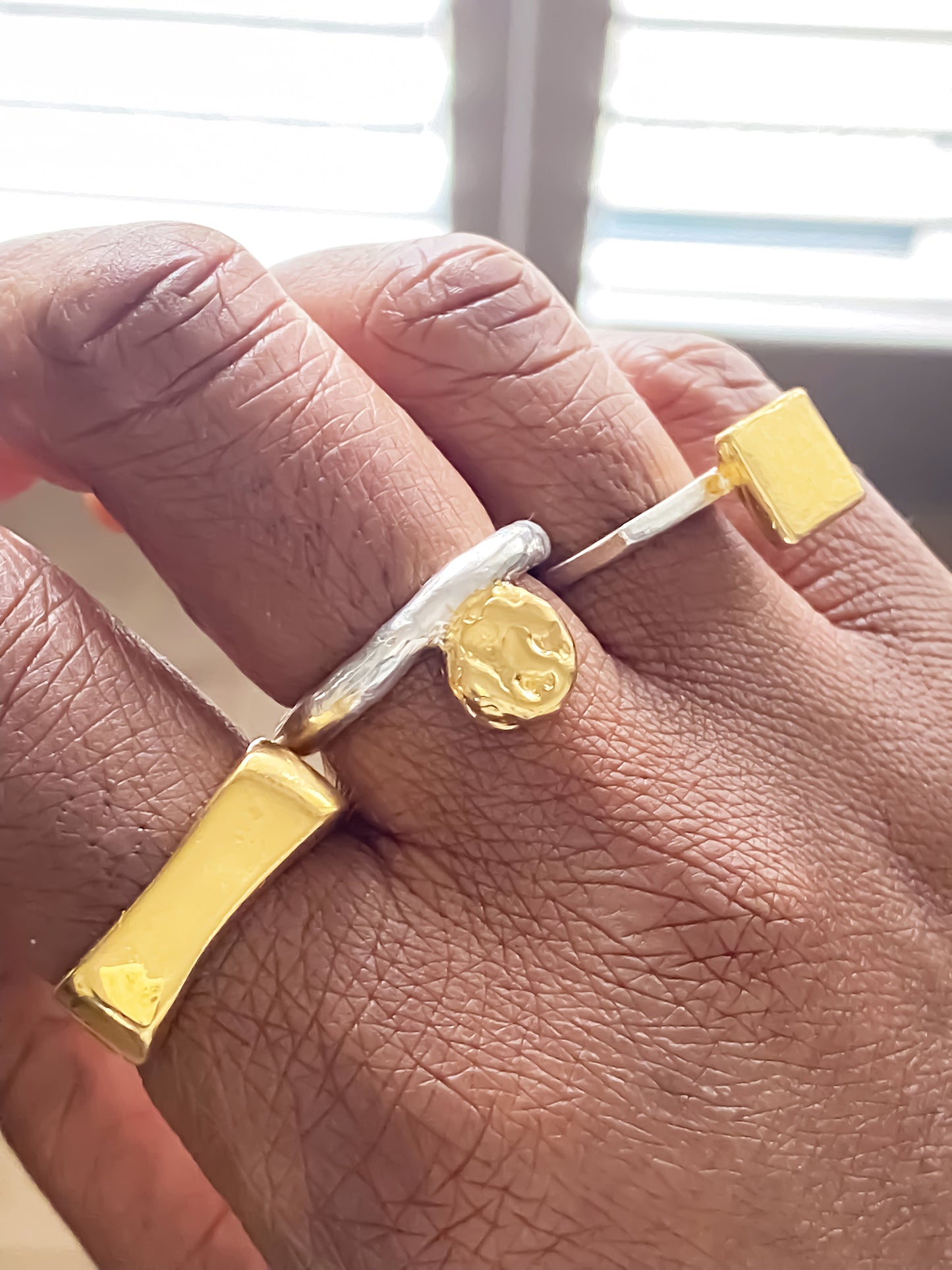 Artisan handmade gold ring set with geometric flair and coin detailing by MOCA Jewellery.