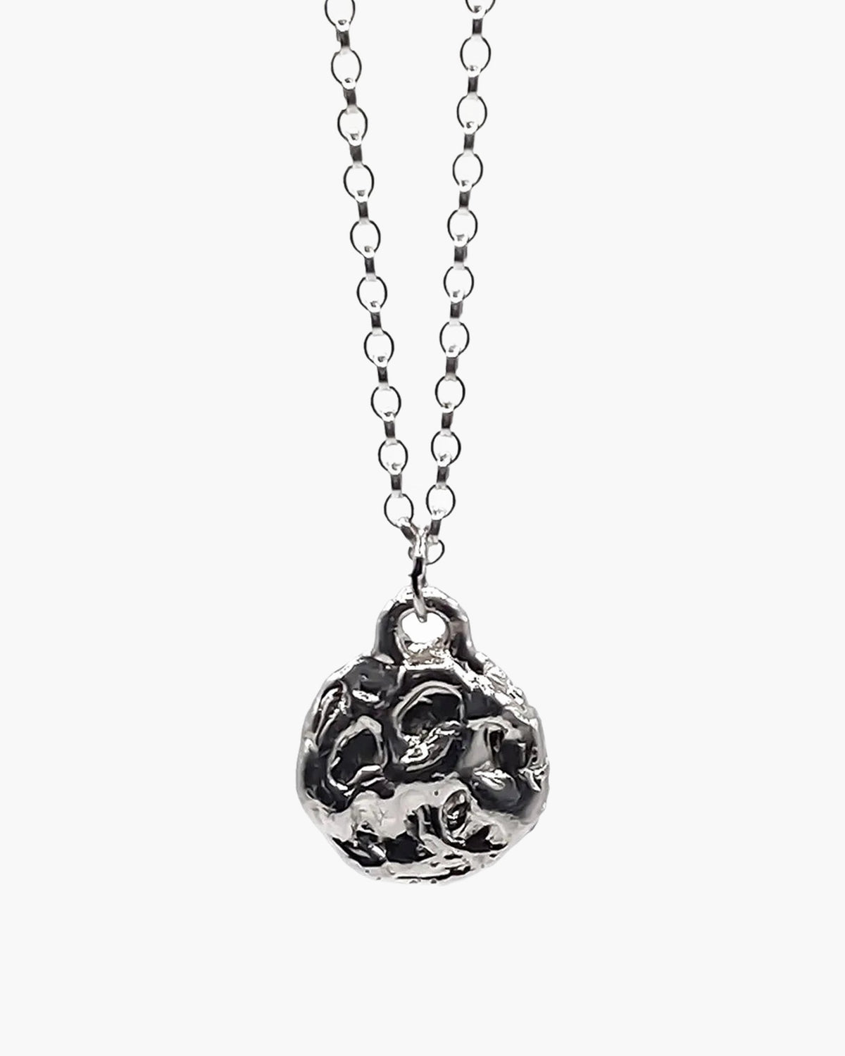 Close-up of the sterling silver Moon pendant