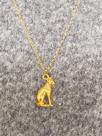 Gold Bast Cat Pendant on wool top, Egyptian inspired jewellery representing Bastet’s mystical charm. Free UK shipping with MOCA Jewellery.