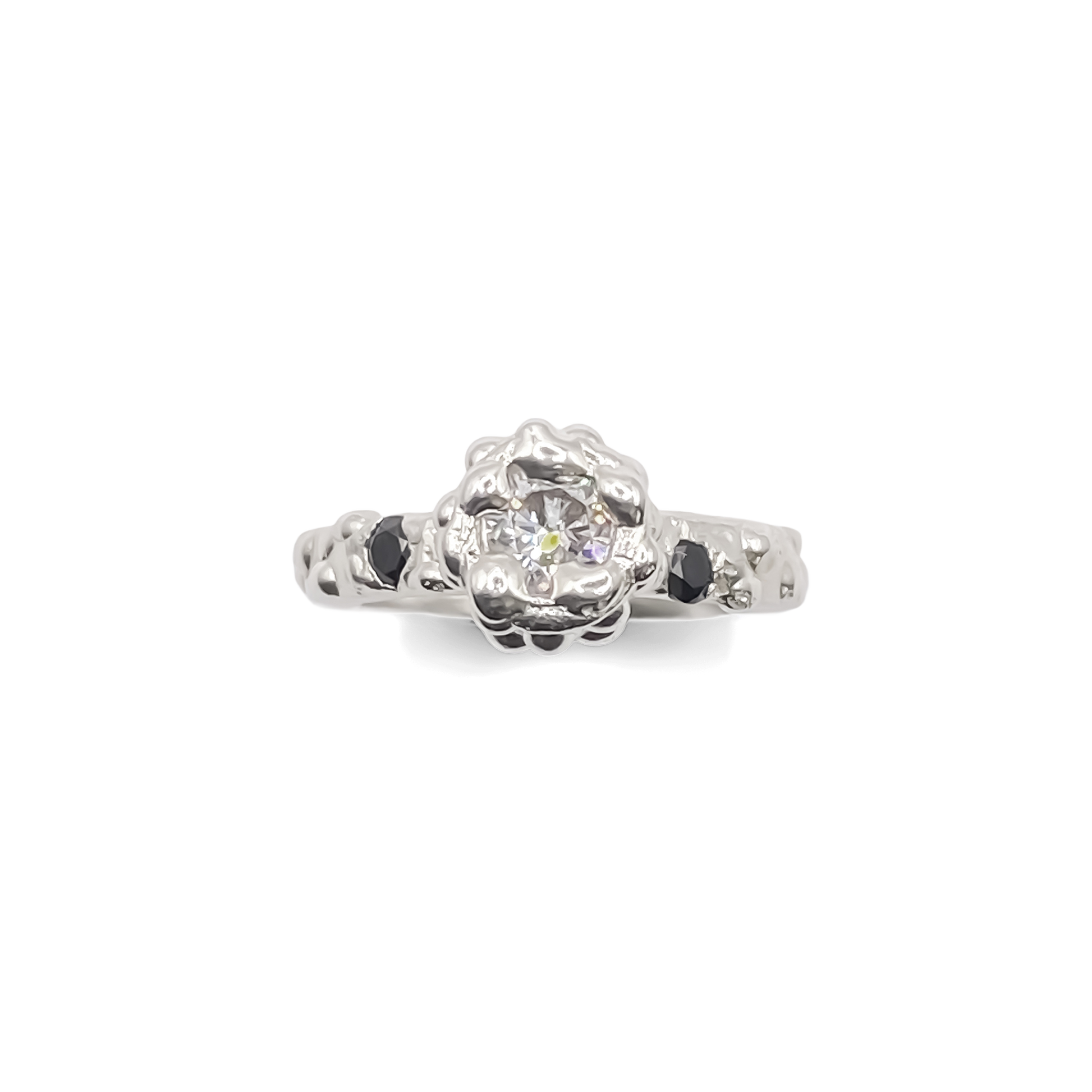 Flatlay of Orbit Ring with full dotted band visible - abstract, bold white and black gemstones gold or silver free shipping