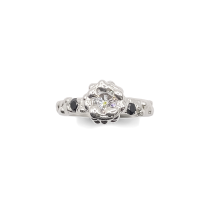 Flatlay of Orbit Ring with full dotted band visible - abstract, bold white and black gemstones gold or silver free shipping