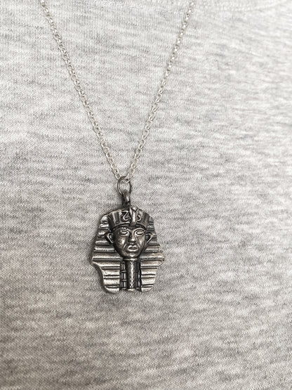 Pharaoh Pendant styled on grey background - oxidised Egyptian African gold or silver free shipping