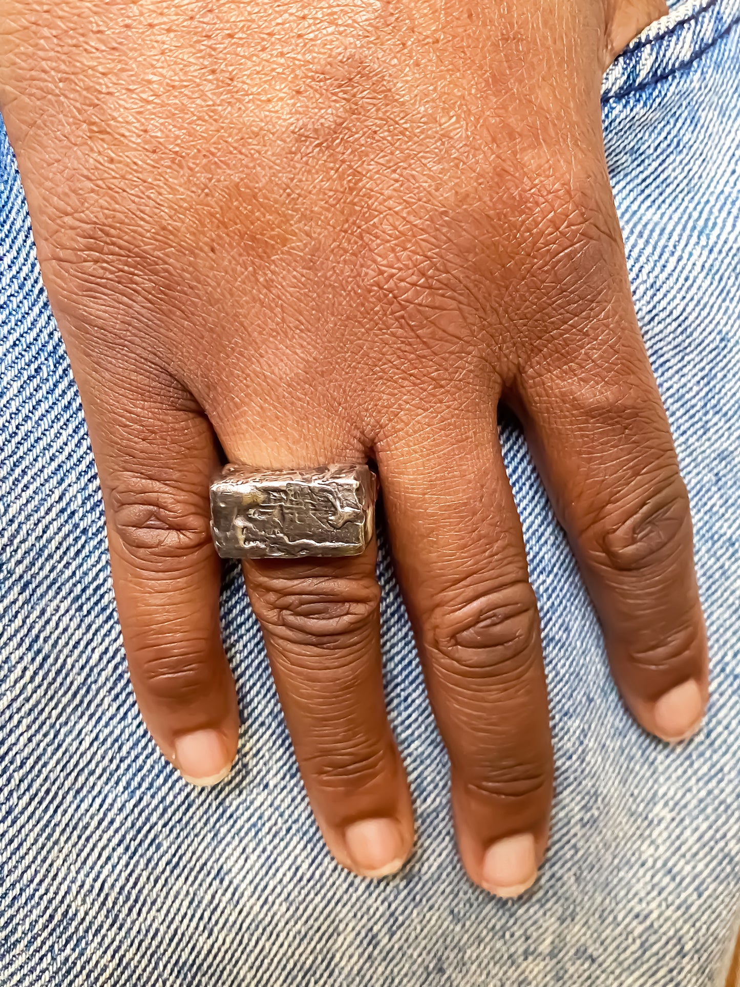 Rippled Signet Ring in oxidised textured gold or silver with free shipping displayed on a hand