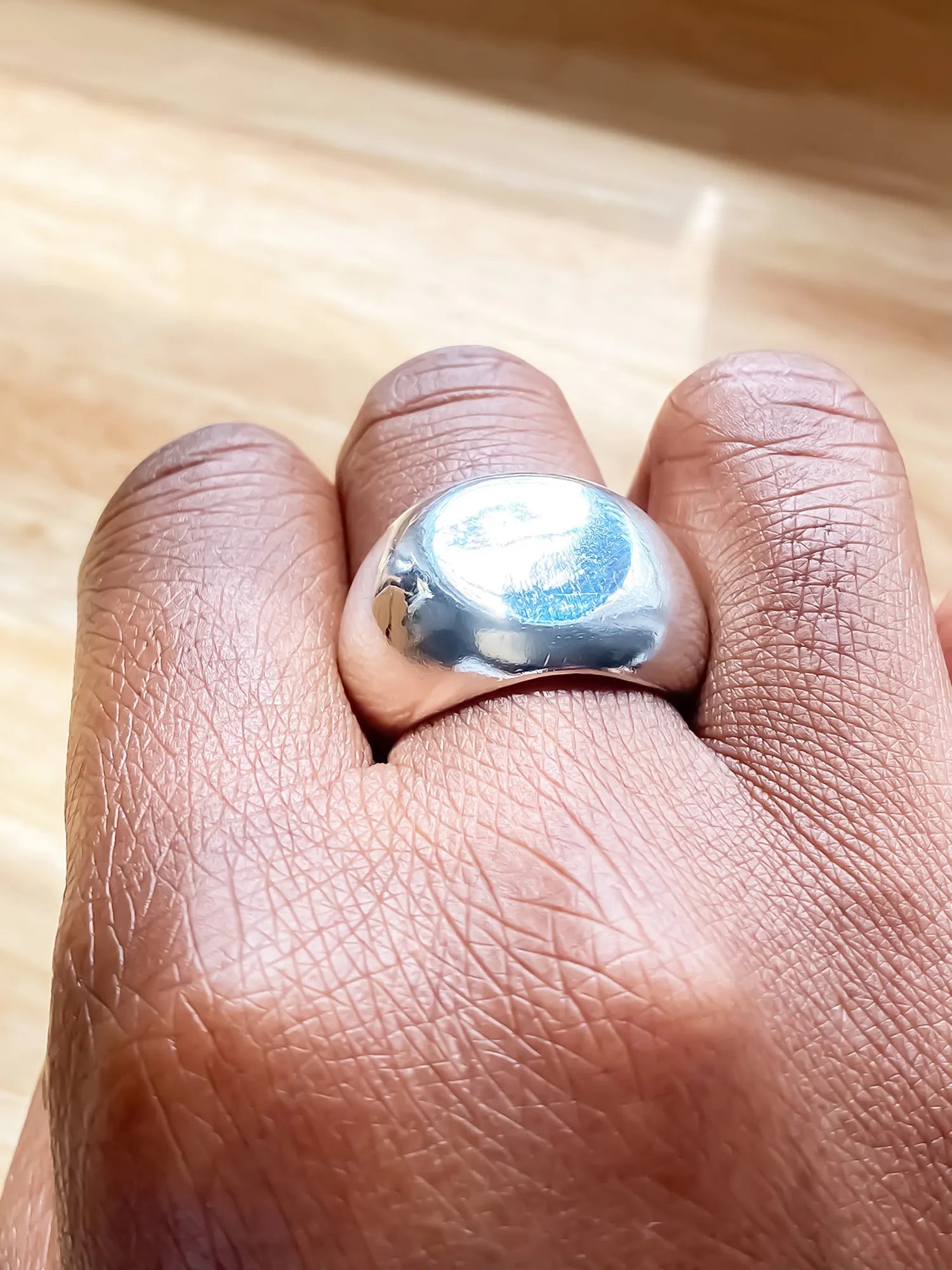 Handcrafted Round Signet Ring in premium metal, artisan jewelry, geometric design, detailed view