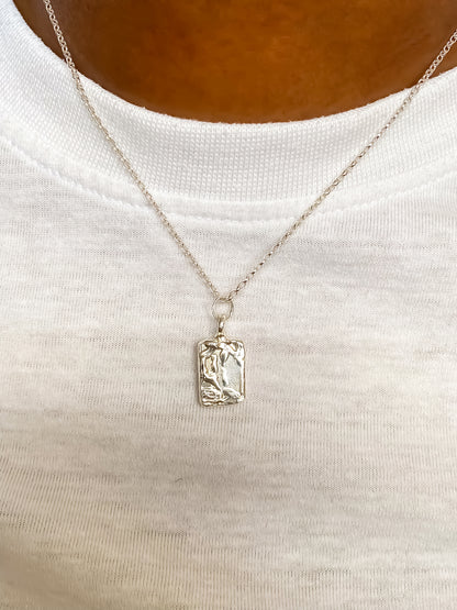 Silver rectangular sculpted pendant worn on neck, sleek and minimal textured style, delicate jewellery with free shipping