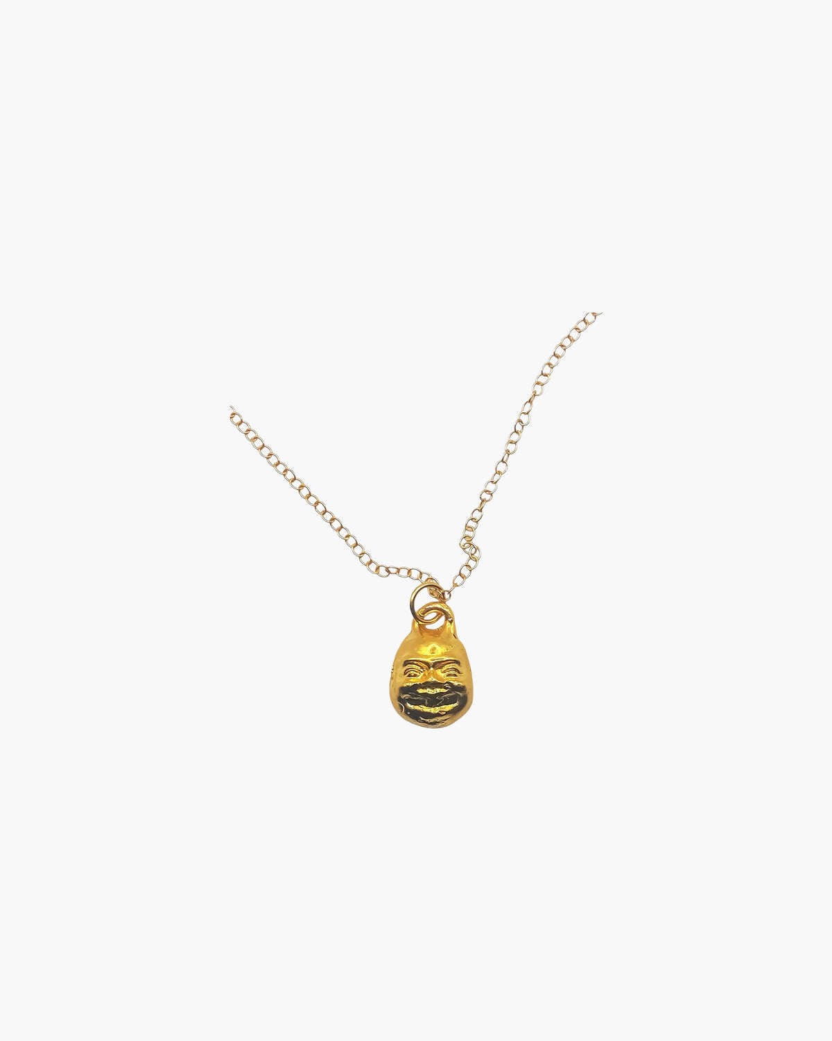 Small Buddha Face Necklace artisan crafted necklace in 18ct Gold Vermeil, zen design, lifestyle shot