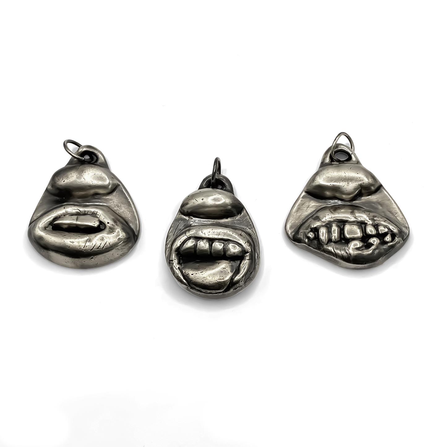 Group display with Smiler Pendant and facial designs - smile mouth lips teeth charming oxidised organic texture gold or silver free shipping