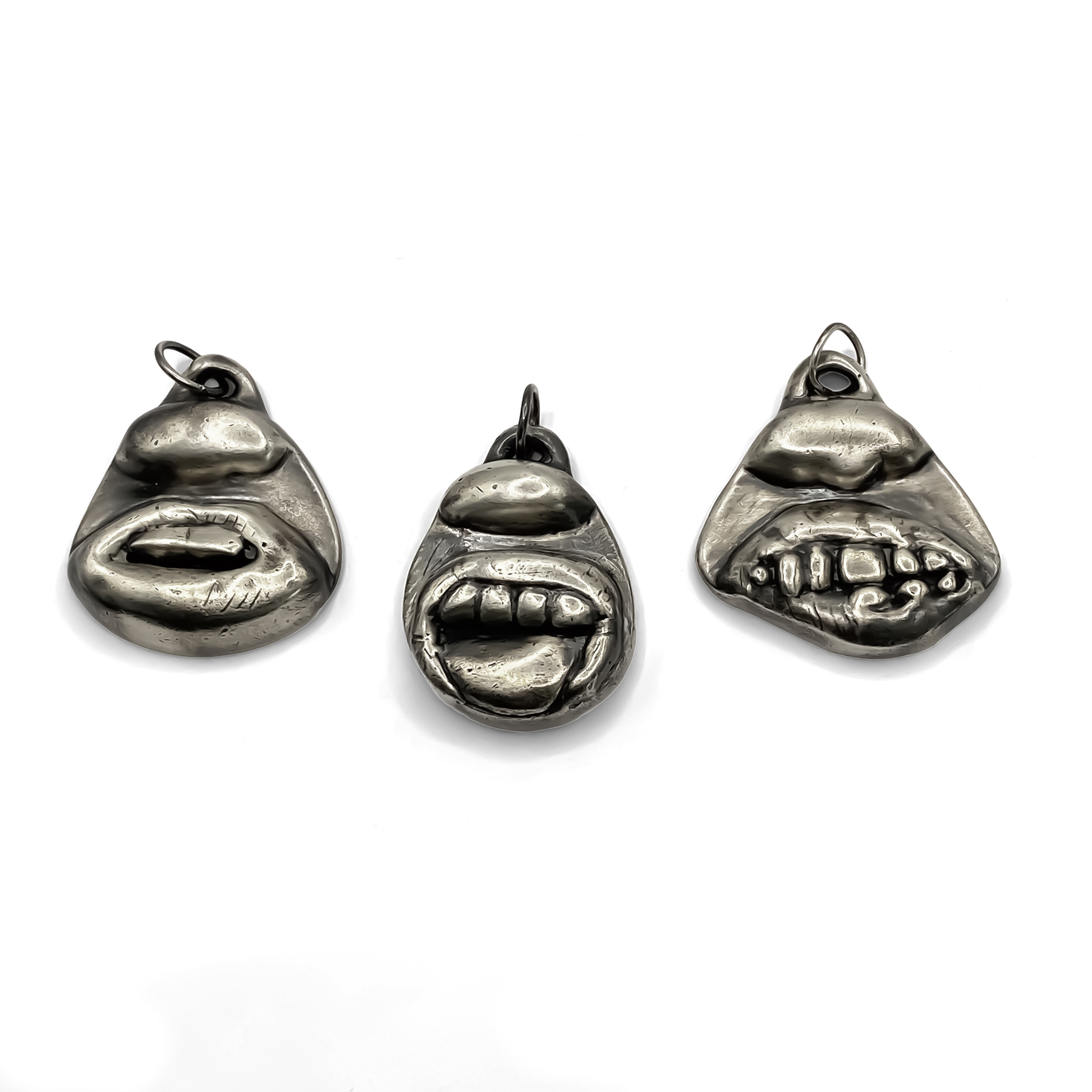 Group display with Smiler Pendant and facial designs - smile mouth lips teeth charming oxidised organic texture gold or silver free shipping