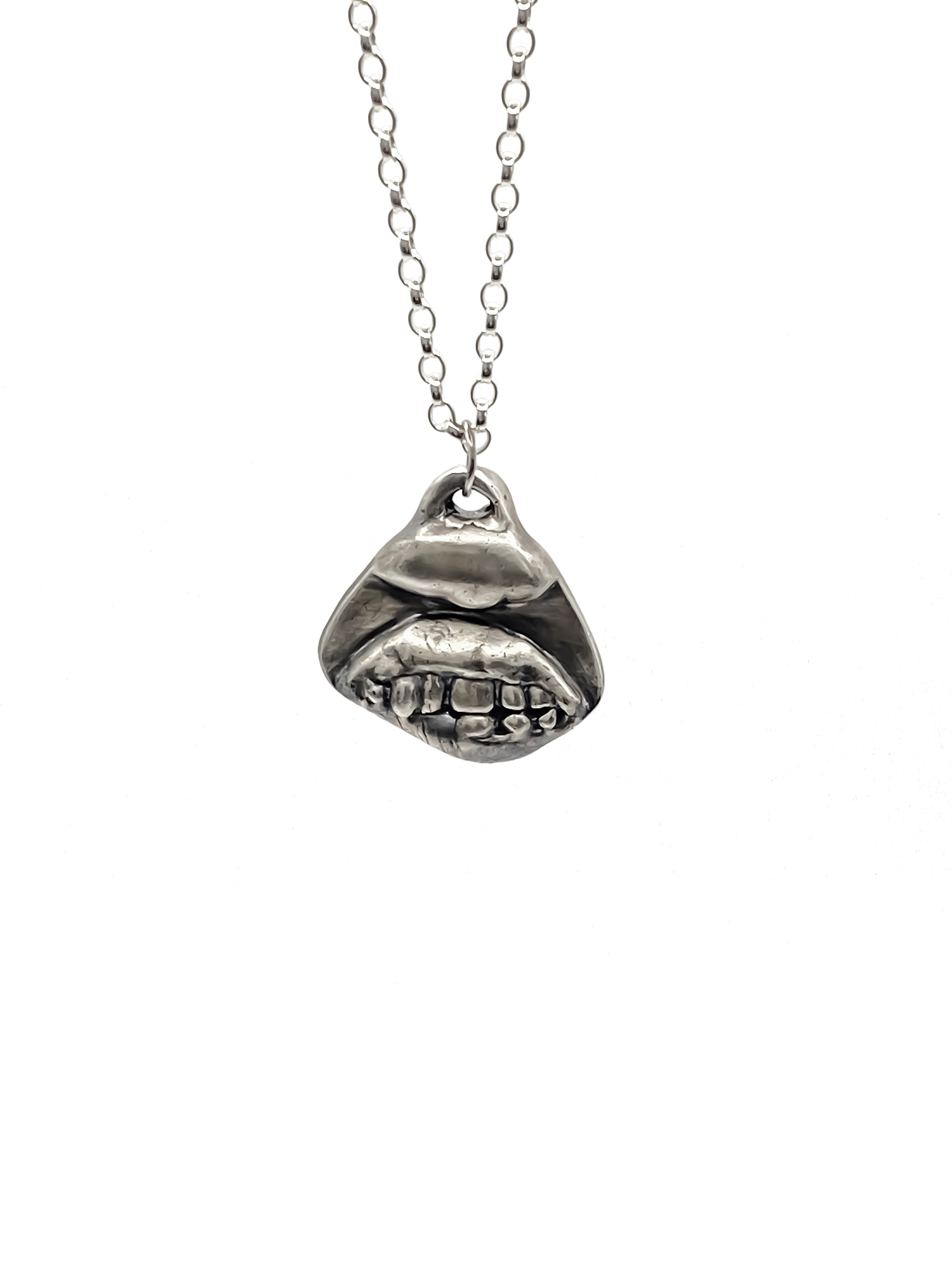 Smiler Pendant shown hanging in frontal view - smile mouth lips teeth charming oxidised organic texture gold or silver free shipping