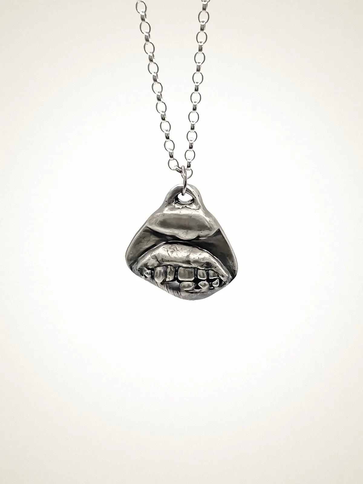 Smiler Necklace artisan crafted necklace in premium metal, uplifting design, lifestyle shot