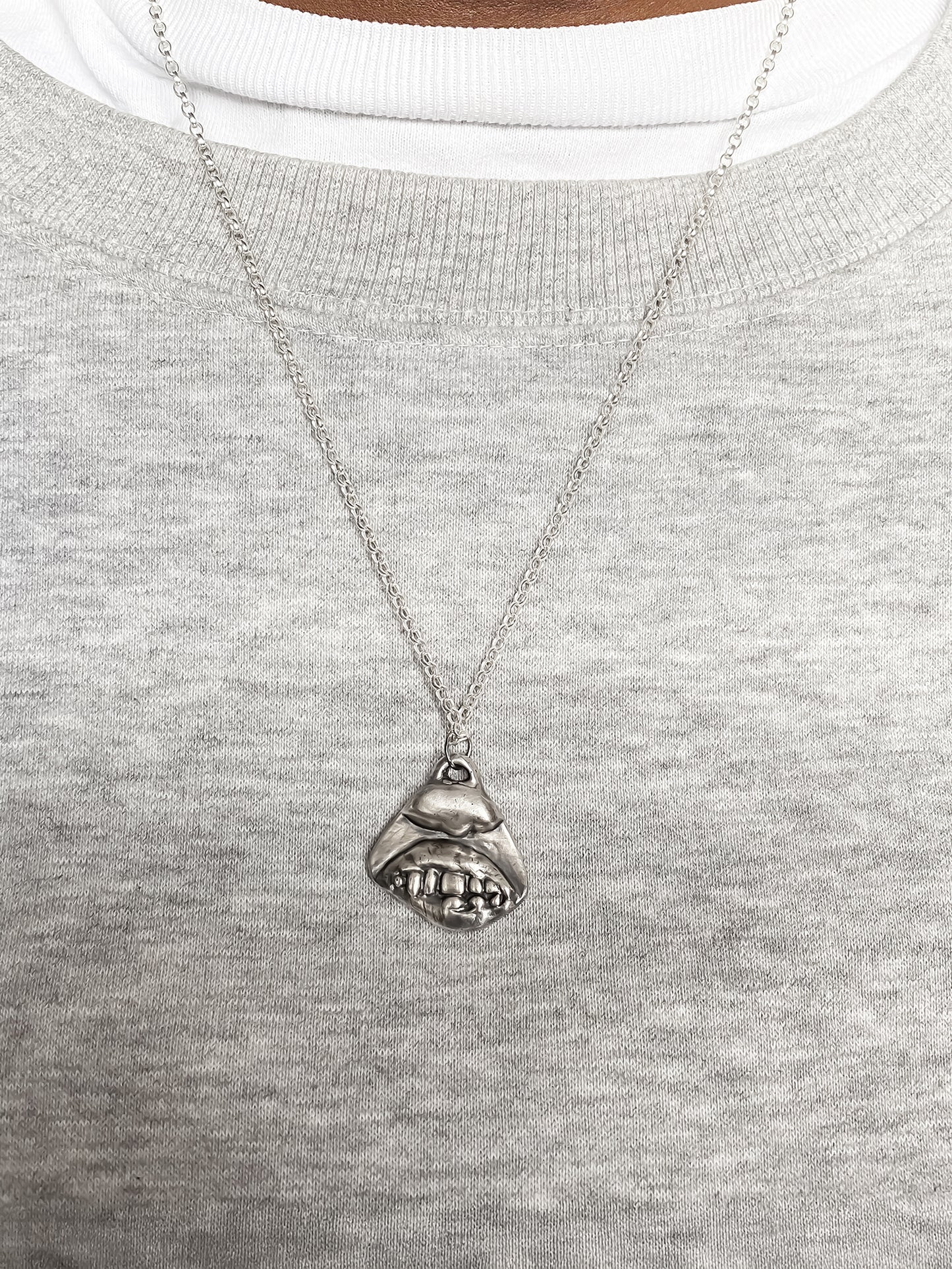 Smiler Pendant styled in centre on model - smile mouth lips teeth charming oxidised organic texture gold or silver free shipping