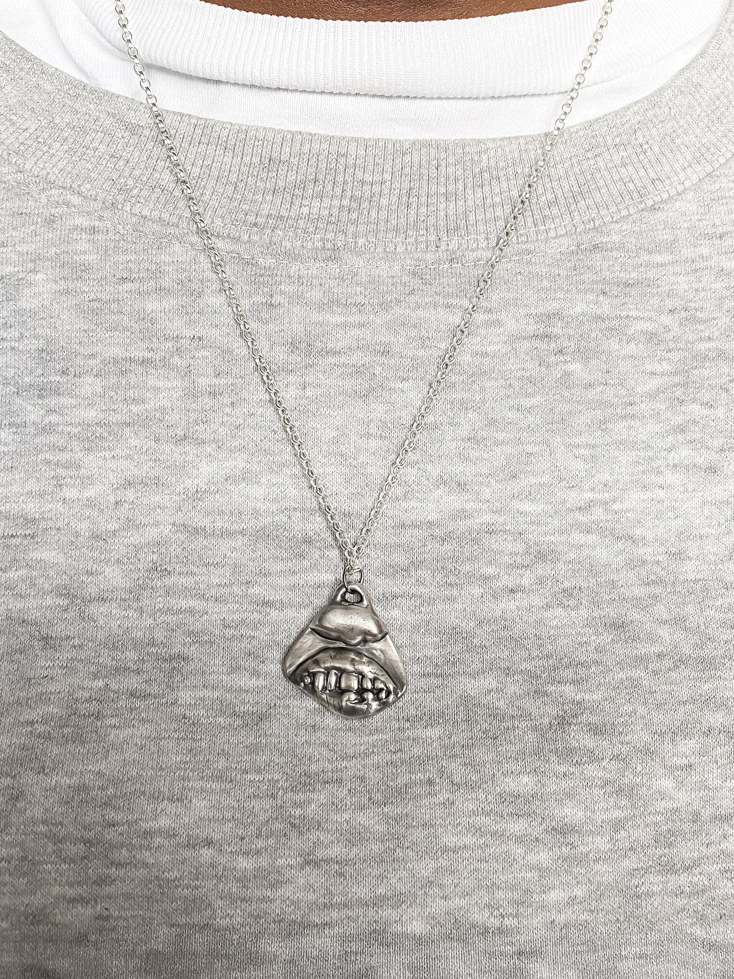 Smiler Pendant styled in centre on model - smile mouth lips teeth charming oxidised organic texture gold or silver free shipping