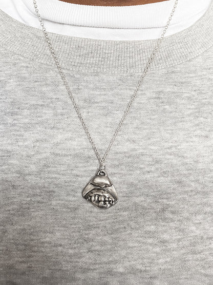 Smiler Pendant styled in centre on model - smile mouth lips teeth charming oxidised organic texture gold or silver free shipping