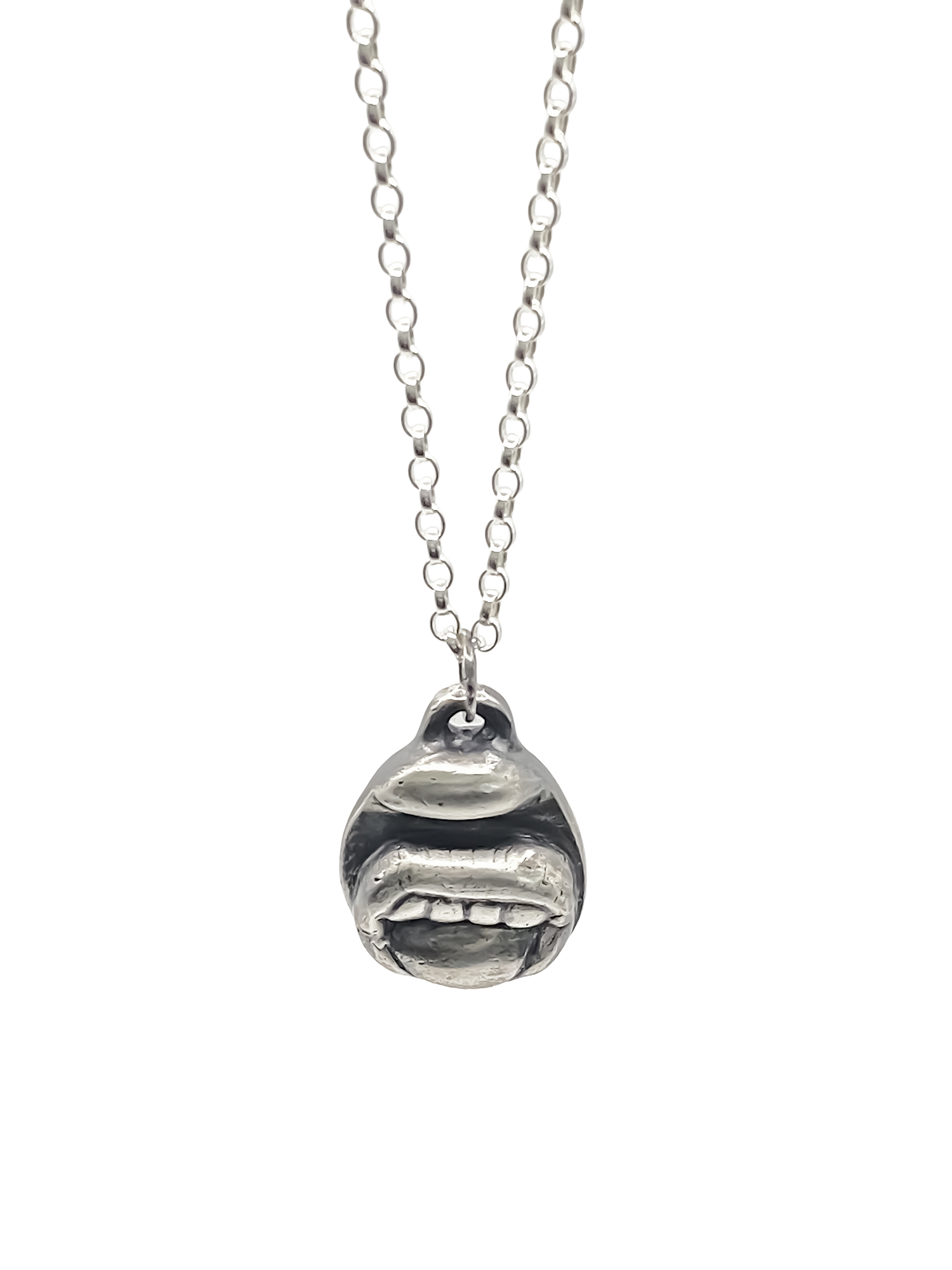Tongue & Teeth Pendant shown hanging front-facing - tongue smile mouth lips charming oxidised organic texture gold or silver free shipping