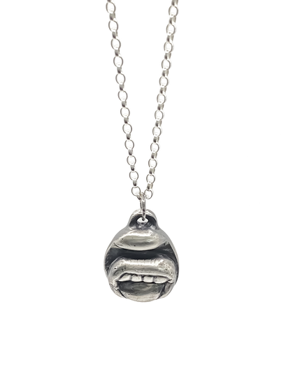 Tongue & Teeth Pendant shown hanging front-facing - tongue smile mouth lips charming oxidised organic texture gold or silver free shipping