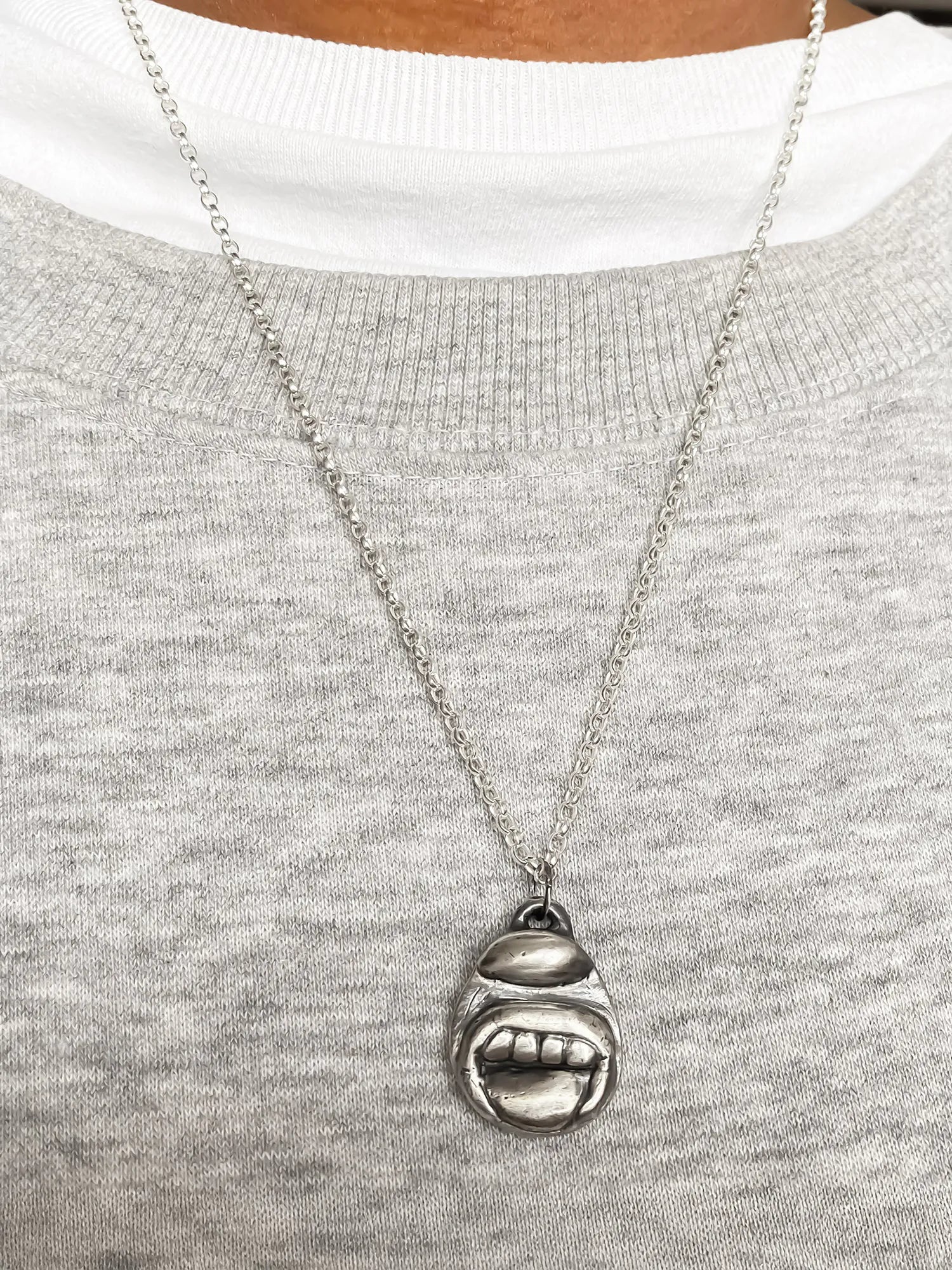 Premium Tongue & Teeth Necklace handmade in premium metal, classic design, worn view