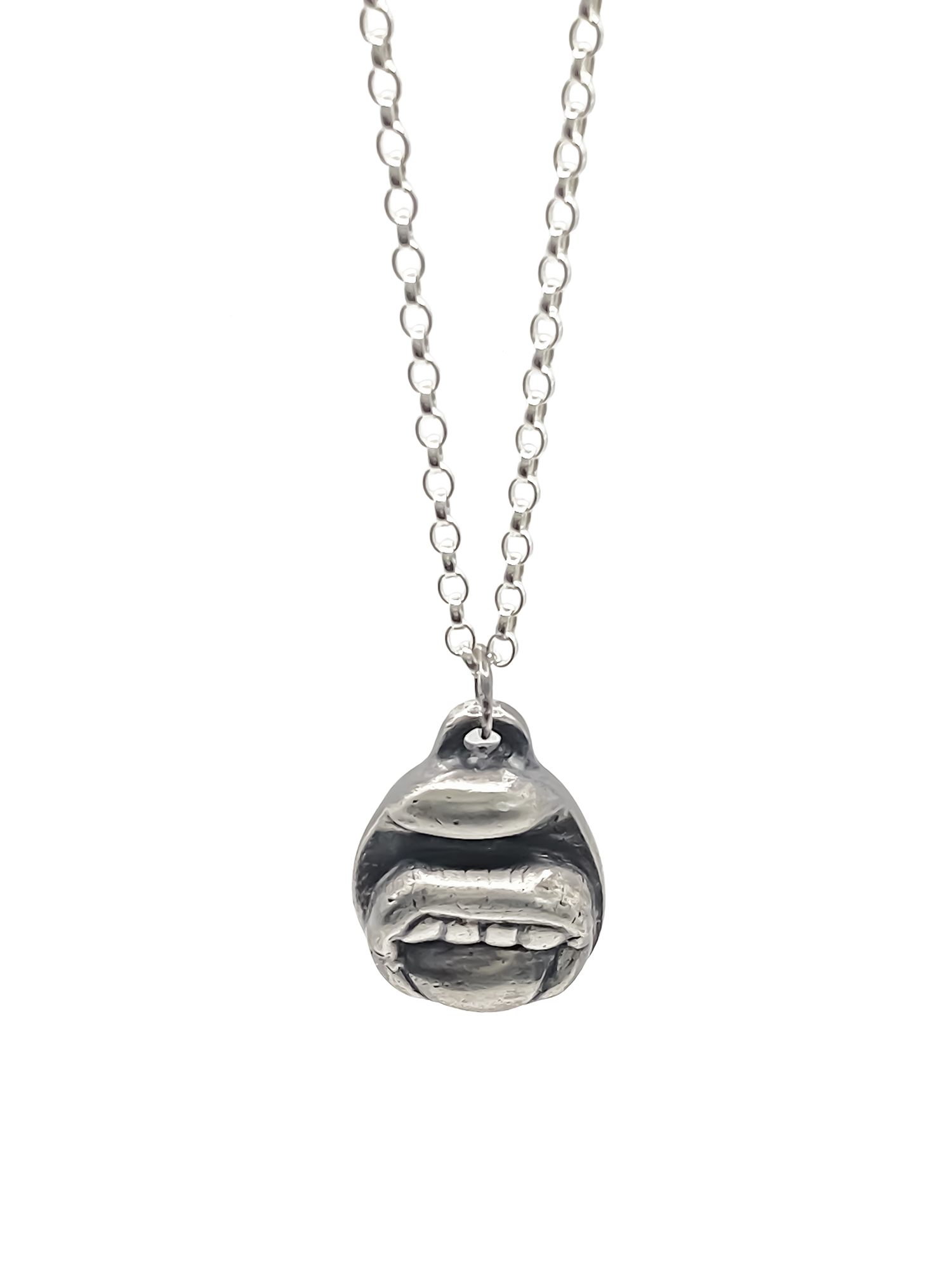 Close-up of Tongue & Teeth Pendant texture and lips - tongue smile mouth lips charming oxidised organic texture gold or silver free shipping