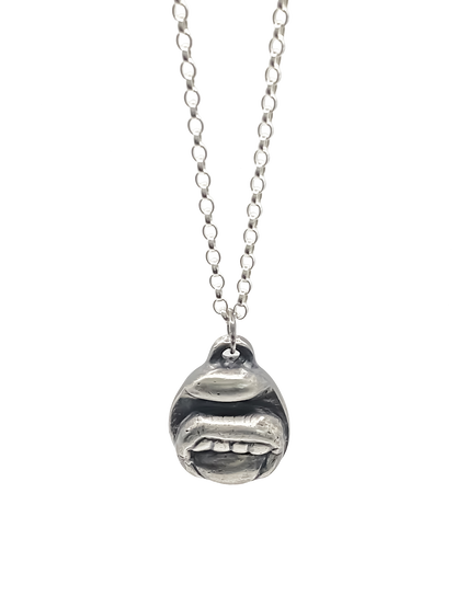 Close-up of Tongue & Teeth Pendant texture and lips - tongue smile mouth lips charming oxidised organic texture gold or silver free shipping