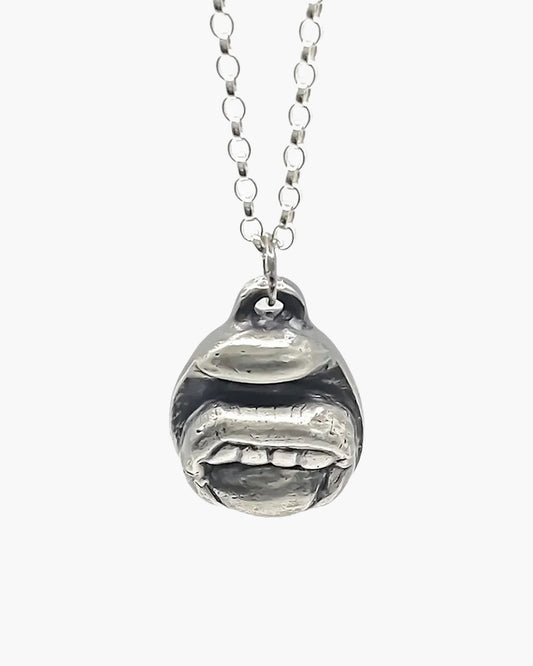 Handcrafted Tongue & Teeth Necklace in Patina, artisan jewelry, elegant design