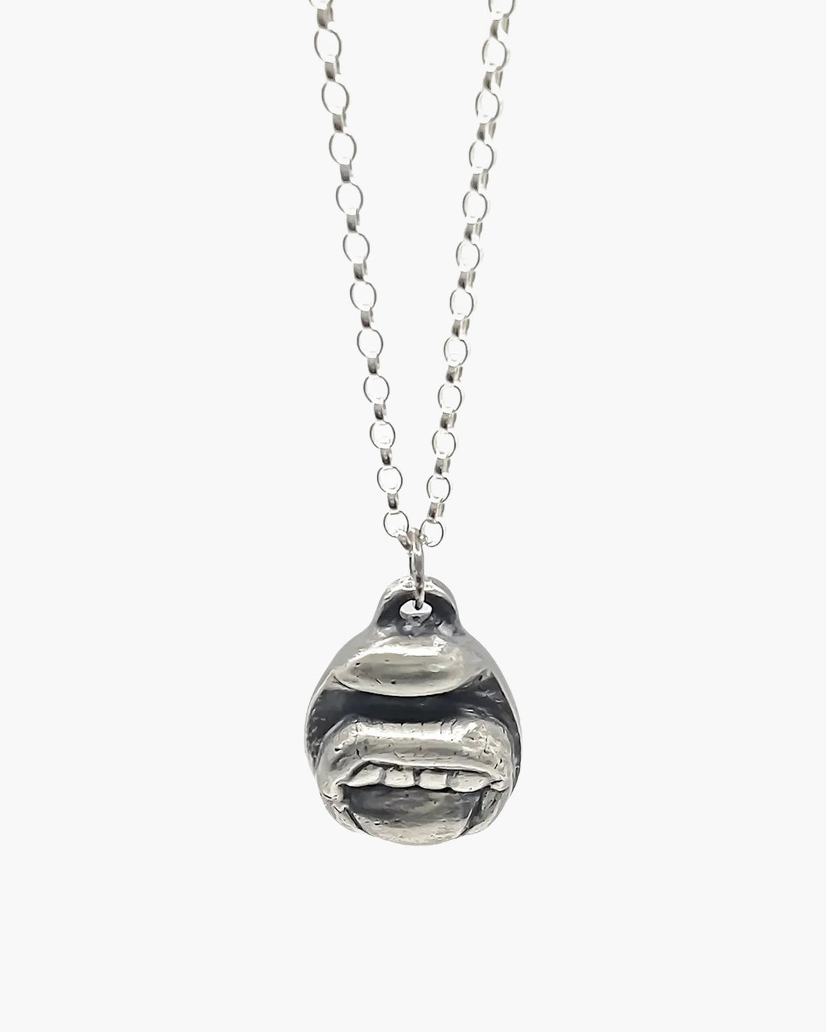 Tongue & Teeth Necklace artisan crafted necklace in premium metal, timeless style, lifestyle shot