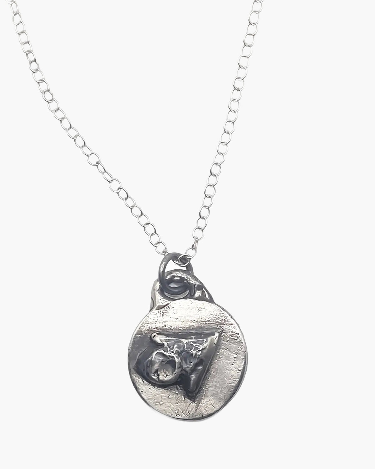 Sterling silver Trainage and Circle pendant, close-up