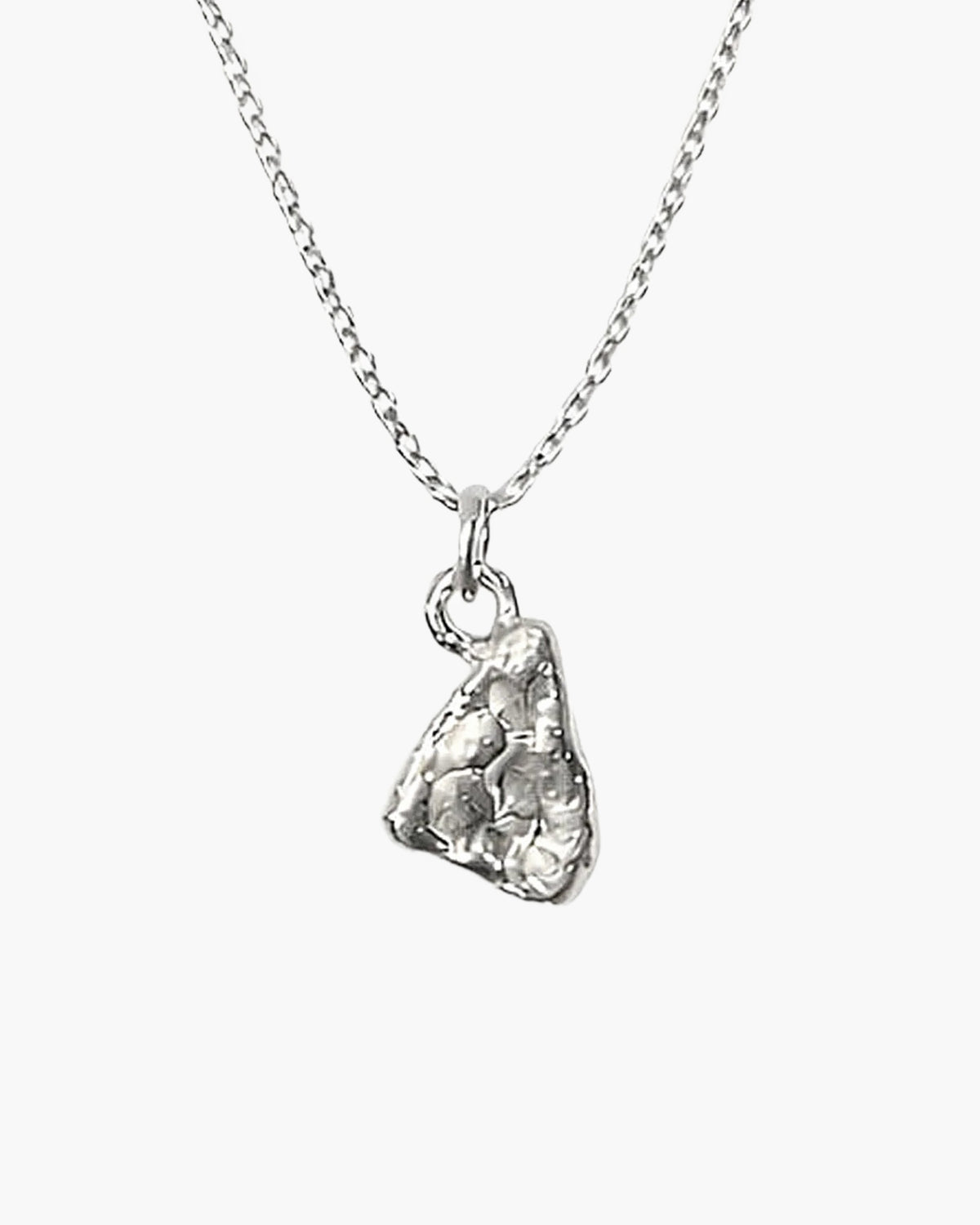 Close-up of the sterling silver Triad Spark pendant