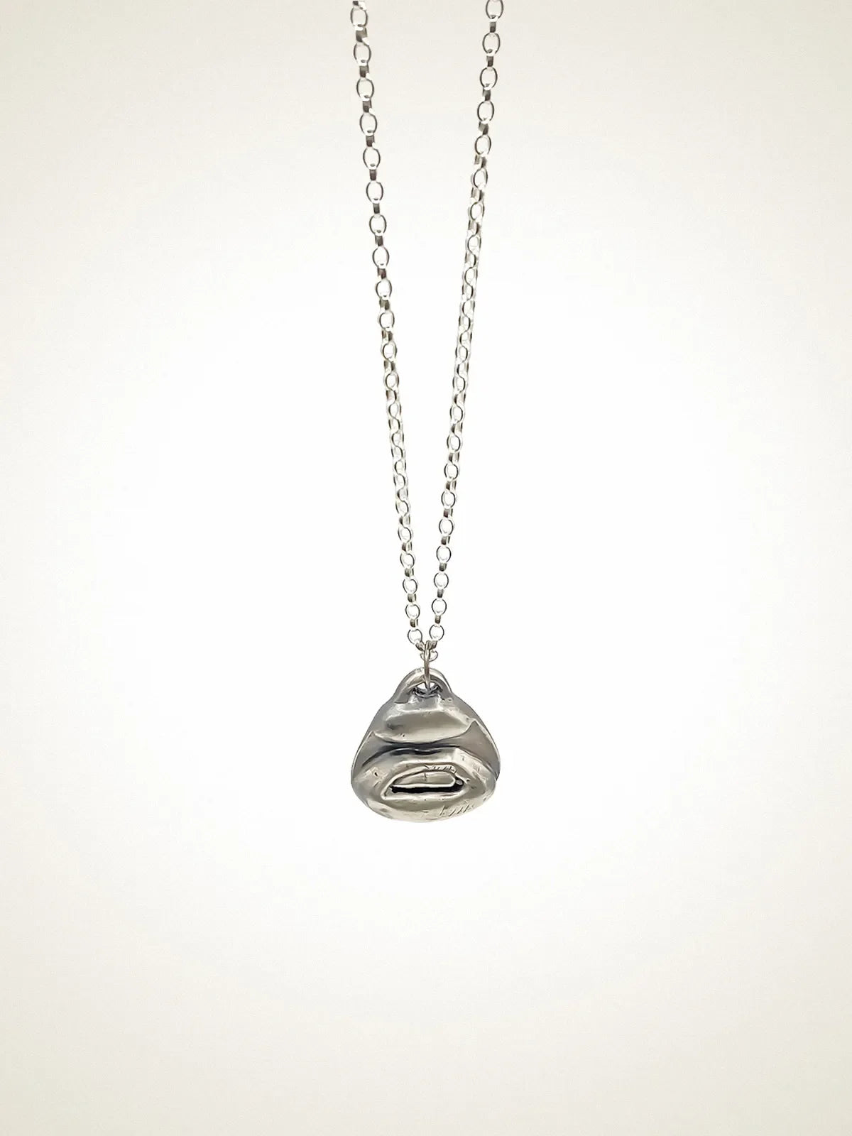 Two Teeth Necklace artisan crafted necklace in premium metal, timeless style, lifestyle shot