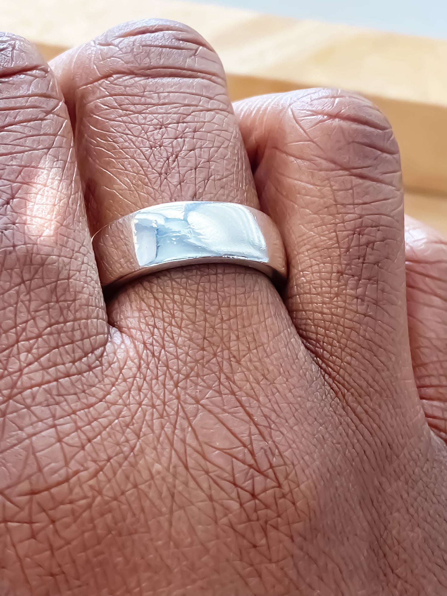 Close-up of Wide Band Ring with soft polished finish - unisex, subtle wedding band bold gold or silver free shipping