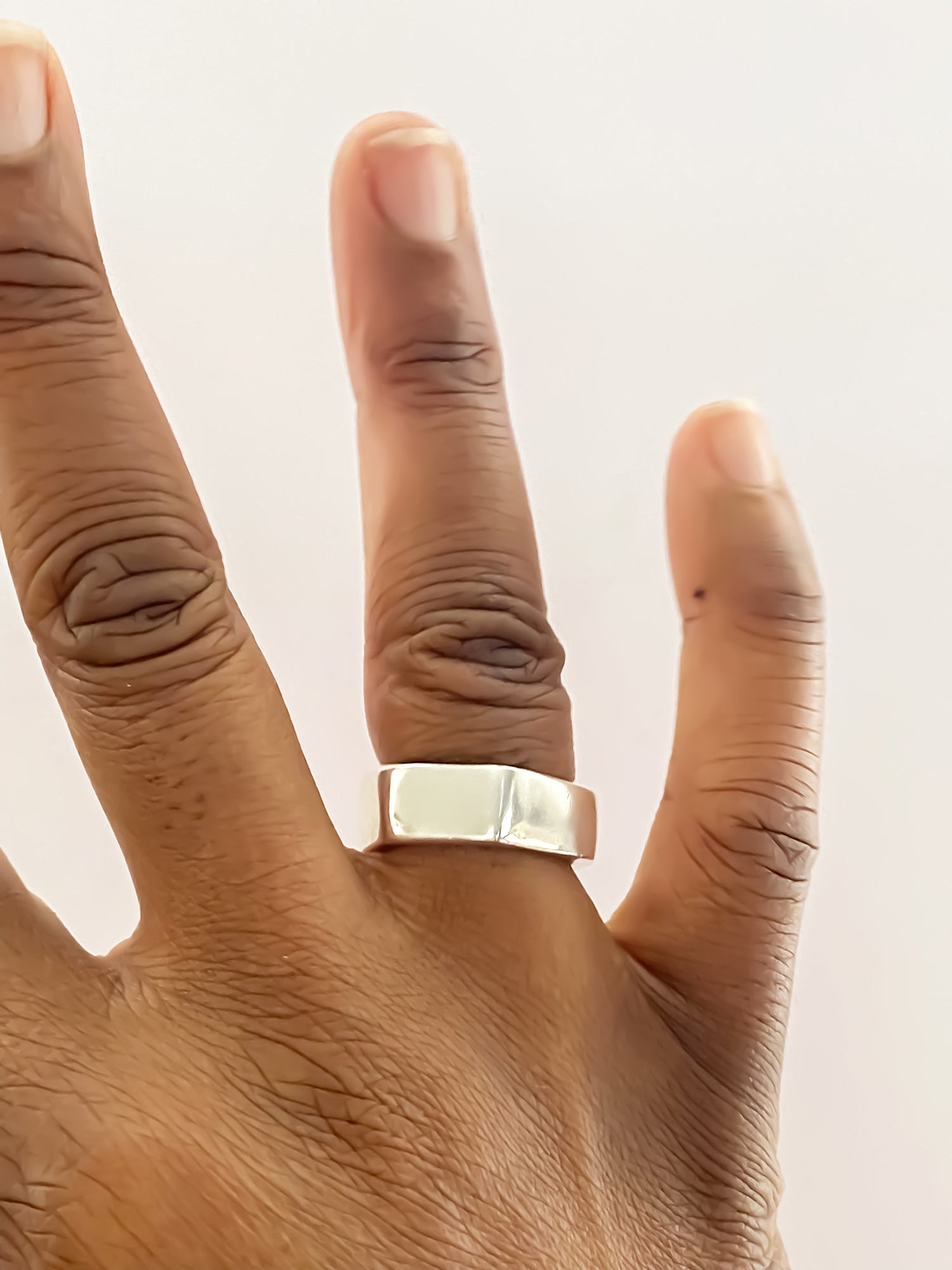 Close-up of Wonky Nut Ring worn on hand - playfully unique elegant gold or silver free shipping